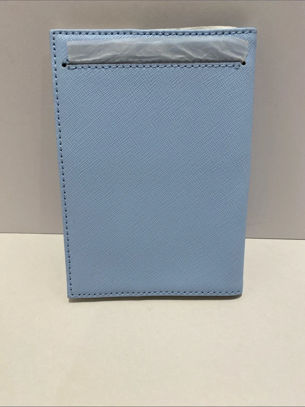 kate spade light blue passport cover. NWT. Flaw on front